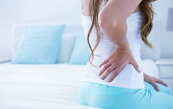 dấu hiệu rụng trứng đau lưng